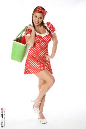 Stripper Picture of Ashley Robbins - Her auburn hair may not be the natural color and it may not match her pubes (when she isn�t completely shaved) but it shows you something about her personality. Ashley doesn�t want to be just another stripper � she wants to capture your imagination and make you one of her fans! Ashley Robbins is Sonia in the Classic cards collection.