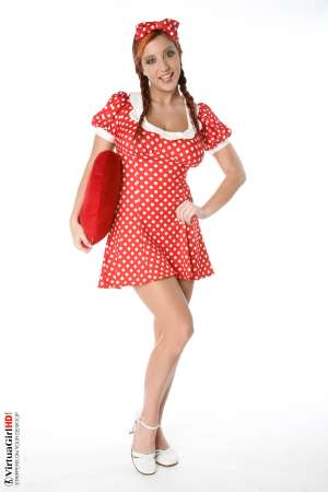 Stripper Picture of Ashley Robbins - Her auburn hair may not be the natural color and it may not match her pubes (when she isn�t completely shaved) but it shows you something about her personality. Ashley doesn�t want to be just another stripper � she wants to capture your imagination and make you one of her fans! Ashley Robbins is Sonia in the Classic cards collection.