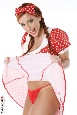 Stripper Picture of Ashley Robbins - Her auburn hair may not be the natural color and it may not match her pubes (when she isn�t completely shaved) but it shows you something about her personality. Ashley doesn�t want to be just another stripper � she wants to capture your imagination and make you one of her fans! Ashley Robbins is Sonia in the Classic cards collection.