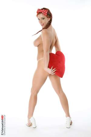 Stripper Picture of Ashley Robbins - Her auburn hair may not be the natural color and it may not match her pubes (when she isn�t completely shaved) but it shows you something about her personality. Ashley doesn�t want to be just another stripper � she wants to capture your imagination and make you one of her fans! Ashley Robbins is Sonia in the Classic cards collection.