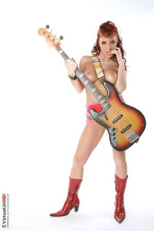 Stripper Picture of Ashley Robbins - Her auburn hair may not be the natural color and it may not match her pubes (when she isn�t completely shaved) but it shows you something about her personality. Ashley doesn�t want to be just another stripper � she wants to capture your imagination and make you one of her fans! Ashley Robbins is Sonia in the Classic cards collection.