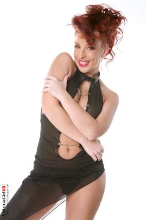 Stripper Picture of Ashley Robbins - Her auburn hair may not be the natural color and it may not match her pubes (when she isn�t completely shaved) but it shows you something about her personality. Ashley doesn�t want to be just another stripper � she wants to capture your imagination and make you one of her fans! Ashley Robbins is Sonia in the Classic cards collection.