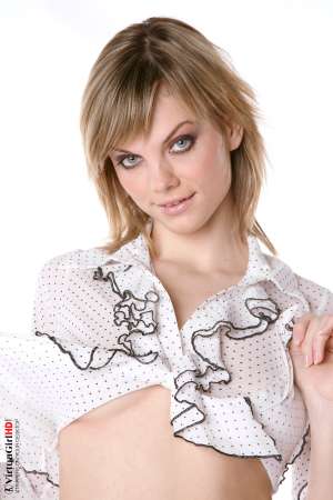 Stripper Picture of Maggie - Maggie is just 22 years old but somehow she has an allure that seems to come from a more classic 1970s or 1960s kind of sex appeal. Many of her fans are older men with more refined tastes. Maggie is like a fine red wine to be savored slowly.