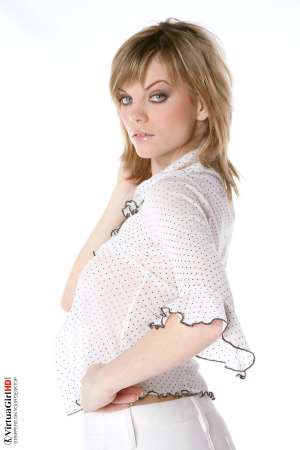 Stripper Picture of Maggie - Maggie is just 22 years old but somehow she has an allure that seems to come from a more classic 1970s or 1960s kind of sex appeal. Many of her fans are older men with more refined tastes. Maggie is like a fine red wine to be savored slowly.