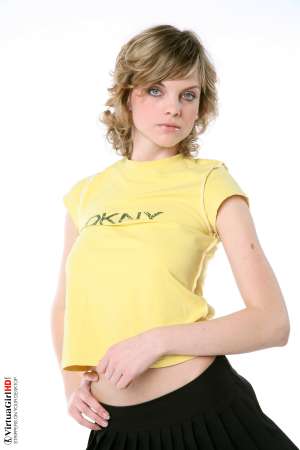 Stripper Picture of Maggie - Maggie is just 22 years old but somehow she has an allure that seems to come from a more classic 1970s or 1960s kind of sex appeal. Many of her fans are older men with more refined tastes. Maggie is like a fine red wine to be savored slowly.