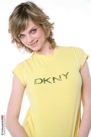 Stripper Picture of Maggie - Maggie is just 22 years old but somehow she has an allure that seems to come from a more classic 1970s or 1960s kind of sex appeal. Many of her fans are older men with more refined tastes. Maggie is like a fine red wine to be savored slowly.