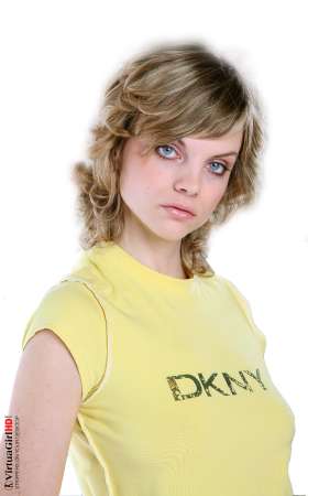 Stripper Picture of Maggie - Maggie is just 22 years old but somehow she has an allure that seems to come from a more classic 1970s or 1960s kind of sex appeal. Many of her fans are older men with more refined tastes. Maggie is like a fine red wine to be savored slowly.