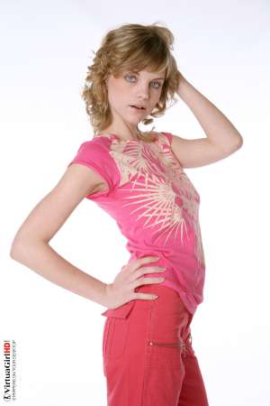 Stripper Picture of Maggie - Maggie is just 22 years old but somehow she has an allure that seems to come from a more classic 1970s or 1960s kind of sex appeal. Many of her fans are older men with more refined tastes. Maggie is like a fine red wine to be savored slowly.