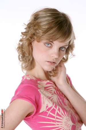 Stripper Picture of Maggie - Maggie is just 22 years old but somehow she has an allure that seems to come from a more classic 1970s or 1960s kind of sex appeal. Many of her fans are older men with more refined tastes. Maggie is like a fine red wine to be savored slowly.