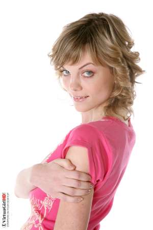 Stripper Picture of Maggie - Maggie is just 22 years old but somehow she has an allure that seems to come from a more classic 1970s or 1960s kind of sex appeal. Many of her fans are older men with more refined tastes. Maggie is like a fine red wine to be savored slowly.