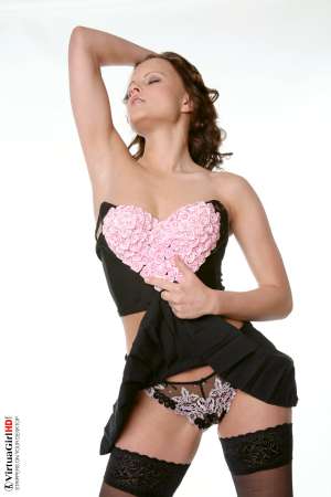 Stripper Picture of Monica Sweet - Adorable petite Monica Sweet is a performer we have had in our studio several times to put on a variety of shows because of her huge popularity with all of our members. We have to admit we were not overly-impressed with her first performance but our members said she just needed a second audition� and as usual they were right!