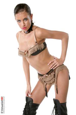 Stripper Picture of Zoe - Dark hair caramel complexion and the most mesmerizing pale green eyes! Zoe is a combination of characteristics that seem at first to be contradictions. Is she a sweetheart or a dominatrix a classy good girl or a nasty dirty slut? When you get to know her better you�ll find out that she is all of those things and more rolled into a single tight package!