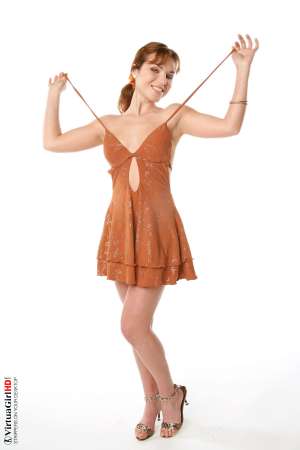 Stripper Picture of Lucie O - We found Lucie O by posting an ad in a local art magazine for a nude model. She answered and wasn�t sure if dancing would be right for her but she gave it her best try and that kind of �can do� attitude is what we liked most about her. She�s a strong willed woman for sure.