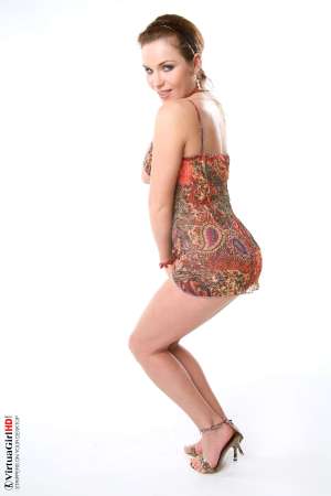 Stripper Picture of Lucie O - We found Lucie O by posting an ad in a local art magazine for a nude model. She answered and wasn�t sure if dancing would be right for her but she gave it her best try and that kind of �can do� attitude is what we liked most about her. She�s a strong willed woman for sure.