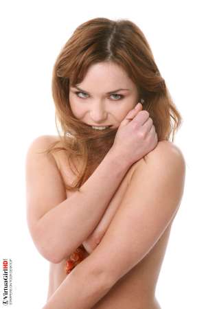 Stripper Picture of Lucie O - We found Lucie O by posting an ad in a local art magazine for a nude model. She answered and wasn�t sure if dancing would be right for her but she gave it her best try and that kind of �can do� attitude is what we liked most about her. She�s a strong willed woman for sure.