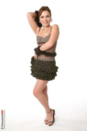 Stripper Picture of Lucie O - We found Lucie O by posting an ad in a local art magazine for a nude model. She answered and wasn�t sure if dancing would be right for her but she gave it her best try and that kind of �can do� attitude is what we liked most about her. She�s a strong willed woman for sure.