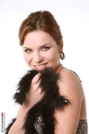 Stripper Picture of Lucie O - We found Lucie O by posting an ad in a local art magazine for a nude model. She answered and wasn�t sure if dancing would be right for her but she gave it her best try and that kind of �can do� attitude is what we liked most about her. She�s a strong willed woman for sure.