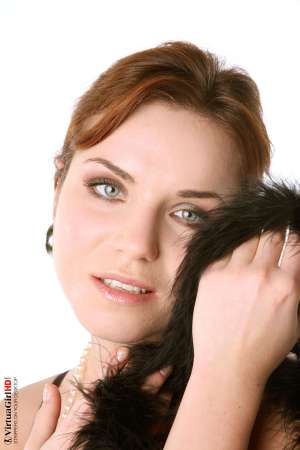 Stripper Picture of Lucie O - We found Lucie O by posting an ad in a local art magazine for a nude model. She answered and wasn�t sure if dancing would be right for her but she gave it her best try and that kind of �can do� attitude is what we liked most about her. She�s a strong willed woman for sure.