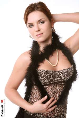 Stripper Picture of Lucie O - We found Lucie O by posting an ad in a local art magazine for a nude model. She answered and wasn�t sure if dancing would be right for her but she gave it her best try and that kind of �can do� attitude is what we liked most about her. She�s a strong willed woman for sure.