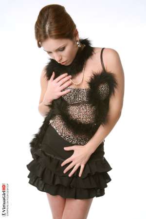 Stripper Picture of Lucie O - We found Lucie O by posting an ad in a local art magazine for a nude model. She answered and wasn�t sure if dancing would be right for her but she gave it her best try and that kind of �can do� attitude is what we liked most about her. She�s a strong willed woman for sure.