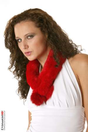 Stripper Picture of Andie - Andie is a Curly haired cutie with one of the best asses we have had the privilege of filming. The way her perfect bubble-butt peaks out at you from beneath her skirt as she shakes that ass is the stuff legends are made from. She�ll really make your heart race!