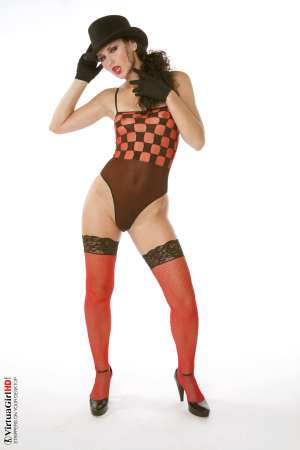 Stripper Picture of Andie - Andie is a Curly haired cutie with one of the best asses we have had the privilege of filming. The way her perfect bubble-butt peaks out at you from beneath her skirt as she shakes that ass is the stuff legends are made from. She�ll really make your heart race!