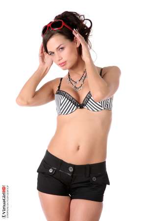 Stripper Picture of Marie - When we met Marie we could not believe what a nice sweet girl she really is and you'll see the way that comes through during her performances as well. She considered a career in nursing before choosing to become a dancer instead. With a few well placed tattoos and the most adorable shaved pussy your eyes have ever seen!