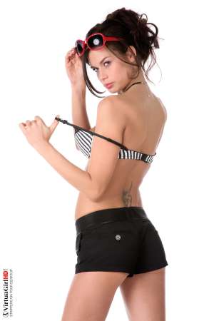 Stripper Picture of Marie - When we met Marie we could not believe what a nice sweet girl she really is and you'll see the way that comes through during her performances as well. She considered a career in nursing before choosing to become a dancer instead. With a few well placed tattoos and the most adorable shaved pussy your eyes have ever seen!