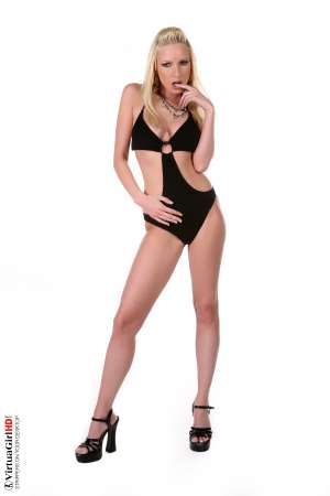 Stripper Picture of Alexandra - Her long blonde hair and skinny physique evokes imagery of 1970s go-go girls from the memory of older members but for many of our younger members Alexandra is a blonde Babe from Budapest with moves and energy unlike anything they've ever seen before!