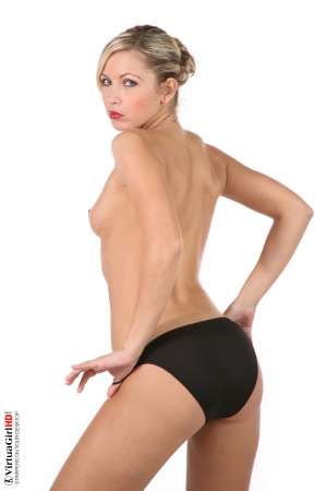 Stripper Picture of Jenni Gregg - She�s a blonde haired green eyed beauty with the all natural body that will have you licking your lips as she struts across your screen. Jenni Gregg is the perfect choice if you enjoy natural tits and high energy moves. Go ahead and give this vivacious angel some of your most intimate affection!