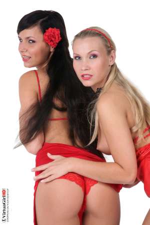 Stripper Picture of Carie & Misa - Blonde goddess Misa has appeared on VirtuaGirl a few times in the past Carie is new and in need of some additional training! We get many requests to pair girls together for duo shows and always are asked to mix new girls with experienced stars. There is something even more exciting about watching the girls together and they learn from one another and teach each other too!