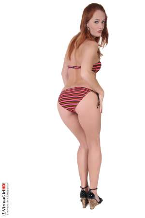 Stripper Picture of Heaven - This redheaded angel is a touch of heaven right here on Earth. When she struts herself out on stag wiggles her perfect ass and plays with you as you watch every second of the action with erotic anticipation you�ll be thinking one thing the whole time �I wish I was in Heaven!� Download this new darling for your collection and have her with you anywhere you go.