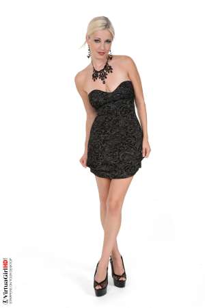 Stripper Picture of Danielle Trixie - At 25 years of age Danielle is an All American blonde who can go from being cute and flirty to daring and dirty all in the blink of an eye. She loves to wear high heels and fans adore the way she wiggles when she walks in those sexy stiletto heel shoes. She's on her way to being the most popular foot fetish model of all time and she loves the attention!