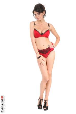 Stripper Picture of Jasmine Andreas - Jasmine Andreas is a 23 years old Edinburgh girl who has quite the personality. She loves slipping into a cute elegant or sexy outfit and letting the clothes shape the mood. She's an adorable college girl in short shorts and a crop top and a total romantic in red lingerie that leaves plenty of hints about what's underneath.