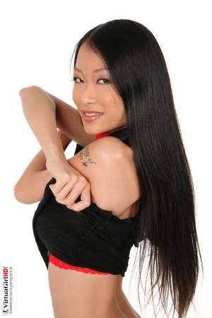 Stripper Picture of Pussykat - PussyKat is the perfect international mix of culture and heritage. Her small frame and muscular physique make her one of the most powerful 20 years old performers ever to appear in a live show. Capable of athletic moves that come from her Vietnam gymnastics background and as sultry as any French cabaret starlet. This girl has it all!