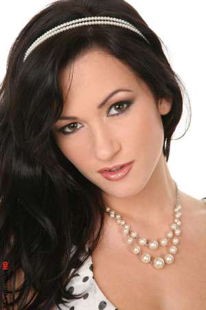 Stripper Picture of Tess Lyndon - Tess Lyndon is dancing solo for you and she's ready to send some good vibrations your way. A twenty one year old from the Czech Republic she looks amazing in her high heels and her white lace pantie set with those dark nipples peeking out at you from behind their thin veil.