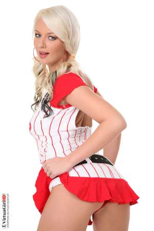 Stripper Picture of Alice Saint - There is something about tall blondes that drive men mad and one look at Alice Saint and those long legs will show you why! Mmmm....she looks so good in her pink see through nightie as her nipples get hard against the sheer material. Lucky for you she takes it all off in this super sexy show.