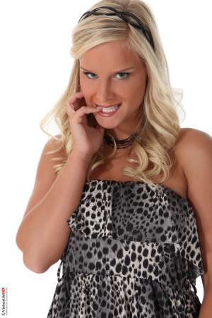 Stripper Picture of Miela - Miela is a new model to us that comes from Prague in the Czech Republic. She is a hot blonde and she says her favorite bedroom game to play is definitely naughty secretary. She likes to be the seductress and in control much better than she likes to be seduced. Miela says she loves the feeling of commanding an audience and making full eye contact with as many people in the room as she can. That intimacy of knowing people are turned on by her body as she looks into their eyes makes dancing worth it for her.