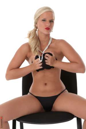 Stripper Picture of Miela - Miela is a new model to us that comes from Prague in the Czech Republic. She is a hot blonde and she says her favorite bedroom game to play is definitely naughty secretary. She likes to be the seductress and in control much better than she likes to be seduced. Miela says she loves the feeling of commanding an audience and making full eye contact with as many people in the room as she can. That intimacy of knowing people are turned on by her body as she looks into their eyes makes dancing worth it for her.