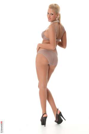 Stripper Picture of Cherry Kiss - Cherry Kiss is a new model we found living in Belgrade Serbia. We couldn't keep our eyes off of her long legs and full hips. Her tiny tits are also perfect additions to her very sexy body and if you haven't noticed we are huge fans of blonde beauties. Cherry is a down to earth diva that enjoys having friends over for dinner and exploring intimate jazz lounges with good music. We are sure you will like her stage performances as much as we do so please welcome Cherry Kiss to the VirtuaGirl forum!