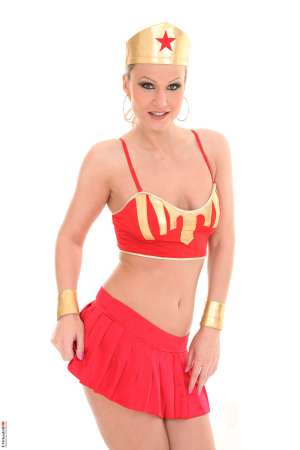 Stripper Picture of Samantha Jolie - Samantha Jolie from the Czech Republic is hot as fire in this solo scene. The color red suits her but those thigh high stockings and bra and pantie set don't stay on long! She strips them off before putting out the fire that's been burning between those luscious legs of hers. Samantha is shaved and ready to show you how she likes her pussy touched.