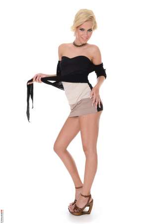 Stripper Picture of Tracy Gold - Tracy Gold came to dance for us from Budapest Hungary. This skinny sexy blonde is a real treat to watch dance her way out of her clothes to reveal her perfect naked body. With long legs and a perfect ass Tracy knows just how to shake her booty to make you want more. In her private life Tracy enjoys trail running and having athletic sex to stay in tip top shape! She loves getting bouquets of daisies over roses from her lovers and she is a huge morning sex person.