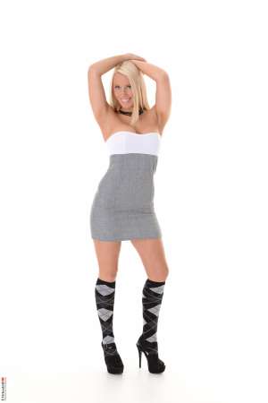 Stripper Picture of Taylor Shay - Taylor Shay is a hot blonde import from the United Kingdom. She is 27 years old and pursuing a Psychology degree at University in Human Sexuality. Taylor is as sexy as she is smart and we know you are going to love every one of her performances especially when you get a look at her big boobs. Taylor has been stripping for a number of years now and she still enjoys getting naked in front of a live audience as well as online. She always tries to answer fan mail and she tells us she loves to hear from the ladies just as much as the men!