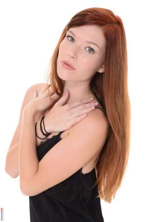 Stripper Picture of Mia Sollis - Mia Sollis is a sexy redhead that we know you are going to love. She is the kind of classy lady that makes everyone feel good when they talk with her. Mia is a self proclaimed people person and she believes it is what makes her striptease performances so special. Mia really connects with her fans and enjoys providing one on one real girlfriend experiences. So connect with Mia and download all her erotic escapades.