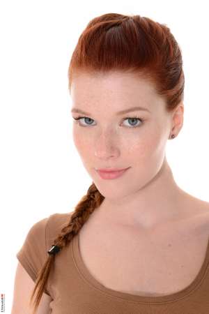 Stripper Picture of Mia Sollis - Mia Sollis is a sexy redhead that we know you are going to love. She is the kind of classy lady that makes everyone feel good when they talk with her. Mia is a self proclaimed people person and she believes it is what makes her striptease performances so special. Mia really connects with her fans and enjoys providing one on one real girlfriend experiences. So connect with Mia and download all her erotic escapades.