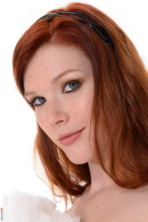 Stripper Picture of Mia Sollis - Mia Sollis is a sexy redhead that we know you are going to love. She is the kind of classy lady that makes everyone feel good when they talk with her. Mia is a self proclaimed people person and she believes it is what makes her striptease performances so special. Mia really connects with her fans and enjoys providing one on one real girlfriend experiences. So connect with Mia and download all her erotic escapades.