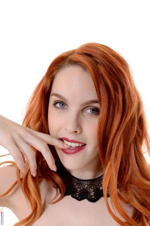 Stripper Picture of Amarna Miller - Amarna Miller is a sexy red head that is heating up the stage here at Virtua Girl. Amarna is a Spanish beauty with a juicy booty and curves galore. She considers her ass her best asset but tells us she totally knows how to work the fiery red hair as well. Amarna loves the attention she gets for being a ginger and she considers flirting one of her favorite hobbies. See her shake her money maker and download all her full performances today.