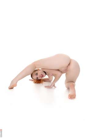 Stripper Picture of Amarna Miller - Amarna Miller is a sexy red head that is heating up the stage here at Virtua Girl. Amarna is a Spanish beauty with a juicy booty and curves galore. She considers her ass her best asset but tells us she totally knows how to work the fiery red hair as well. Amarna loves the attention she gets for being a ginger and she considers flirting one of her favorite hobbies. See her shake her money maker and download all her full performances today.