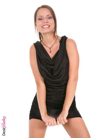 Stripper Picture of Kari - Kari is dressed up in her favorite little black dress so she's ready for anything. Black high heels match perfectly as well as showing off her legs to great effect. Kari is an incredible brunette whose body is petite and toned. She has an air of elegance that shows through in every one of her performances.