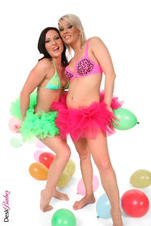 Stripper Picture of Niki Sweet & Iris - Balloon girls Niki Sweet and Iris take a turn discovering the sexual passion that some fans find in watching them use latex balloons as part of their sex toy arsenal. Big bright blown up balloons and their frilly neon tutus give this update a festive carnival feel and shows how much fun hardcore fetish lesbianism has become!